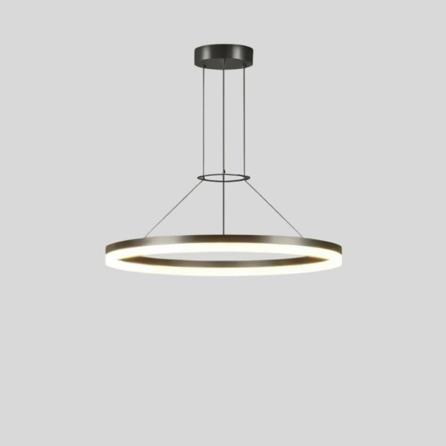 "A modern ring chandelier with a lit ring against a grey background."