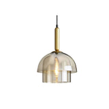"Modern pendant light with layered smoked glass shade and metallic accent, isolated on a white background."