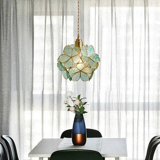 Make a statement with the Camellia Pendant Light, featuring a delicate floral-inspired design that adds a touch of sophistication to your decor.