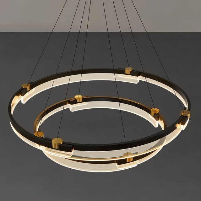 "Close-up of a black and gold Capli chandelier showing the dual aluminum rings and acrylic diffusers."