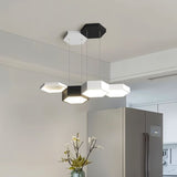"A modern hexagonal pendant light with multiple heads, providing versatile illumination in a contemporary space."