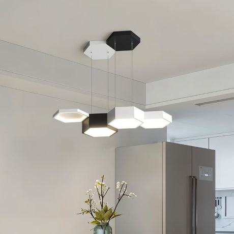 "A modern hexagonal pendant light with multiple heads, providing versatile illumination in a contemporary space."