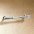 Exploded view of a brass curtain rod ring with finial in polished finish against white background, showing dimensions.