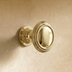 Two decorative cabinet pulls with ornate end caps shown in front view against white background with dimension measurements la
