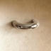 White double arch cabinet pull with curved handles, front view against white background.