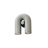 "A gray, contemporary wall lamp with a unique, looped design and two adjustable lights."