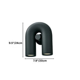 "A contemporary, looped wall lamp with dual light sources, shown in black finish on a white background."