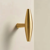 "Modern brass T-bar cabinet knob with a sleek, minimalist design."