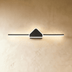 Top view of a modern ceiling light fixture with a triangular central element and horizontal arms, measuring 27.9 inches wide