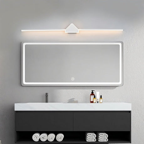 "A modern white wall lamp featuring a geometric centerpiece and a streamlined light bar, positioned above a rectangular mirror in a contemporary bathroom with a dark gray vanity."