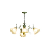 "A floral chandelier with curved iron stems and frosted glass shades, isolated on a white background."