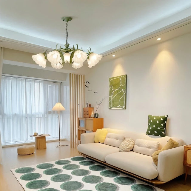 "A floral chandelier with frosted glass shades as a focal point in a beautifully decorated living room."