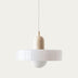 White pendant light with cylindrical shade and spherical base hanging from cord against neutral background.