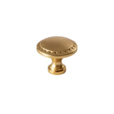 "Vintage solid brass knob with intricate Grecian-inspired patterns, adding a touch of classic elegance to cabinetry."
