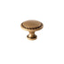 "Vintage solid brass knob with intricate detailing and textured surface, adding depth and character to cabinetry."