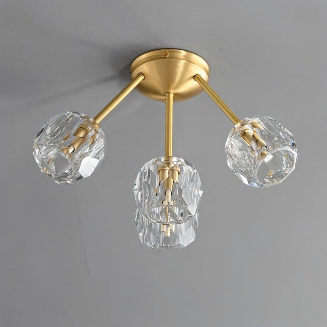 "Modern 4-light ceiling fixture with crystal shades and brass finish."