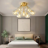 "Modern crystal ceiling light with brass finish illuminating a stylish bedroom."