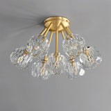 "Modern flush mount ceiling light with crystal shades and brass finish."
