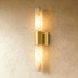 Marble cylindrical wall sconce with brushed nickel hardware, front view on white background, showing dimensions.