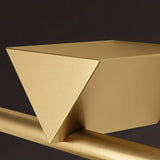 "A close-up view of the Dalane LED wall lamp, showcasing its geometric accent and gold finish."
