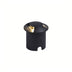 Black cylindrical in-ground outdoor light with brass top accent on white background.