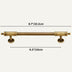 Brass-finished cabinet pull bar with decorative knobs and circular mounting plates on white background.