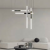 "Modern geometric pendant light with acrylic tubes and marble accents in a contemporary living room."
