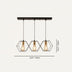 Three-light pendant chandelier with black metal frame, brass accents, and geometric hexagonal glass shades.