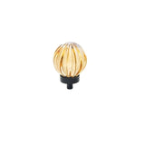 "Amber crystal glass spherical knob with ribbed texture and black base, isolated on a white background."