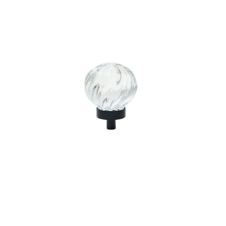 "Clear crystal glass spherical knob with swirl pattern and black base, isolated on a white background."