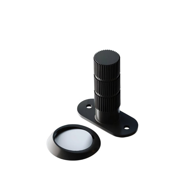 "Modern black door stop with a textured cylindrical post and strong magnetic base."