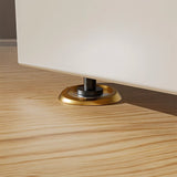 "Gold magnetic door stop installed on a light wood floor, holding a door ajar."