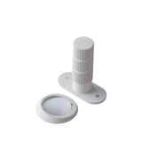 "Modern white door stop with a textured cylindrical post and a magnetic base."
