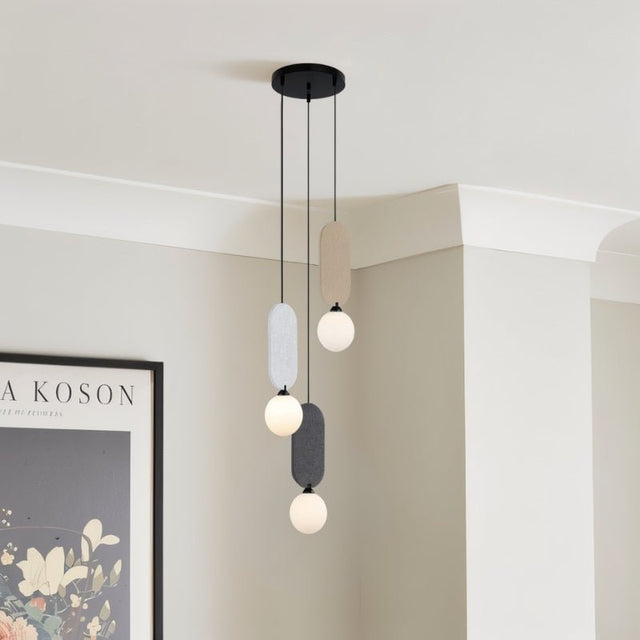 "The Dorea Pendant Lamp features four globes in a sleek design with a metal frame, offering a modern and minimalist ceiling light for contemporary living spaces."