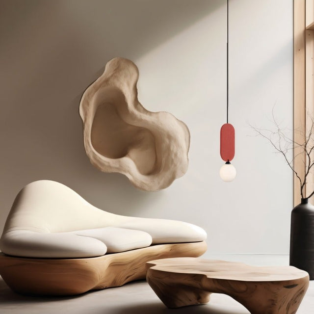 "The Dorea Pendant Lamp illuminates a modern living room with a sleek metal frame and spherical glass bulb. Its minimalist design adds elegance to the space."