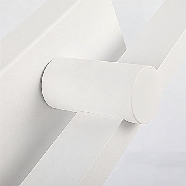 "A close-up view of the Dralis LED vanity light, showcasing its minimalist design and wall-mounted structure."