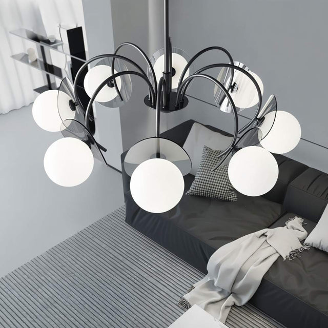 "Overhead view of a copper Dyana chandelier with frosted glass globes hanging above a living room with a grey sofa."