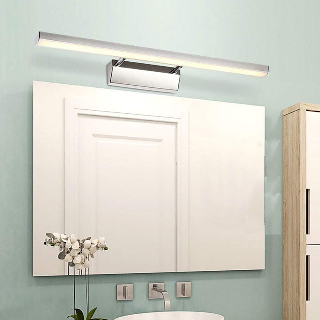 "A modern, minimalist LED wall lamp with a polished stainless steel body, mounted above a bathroom vanity mirror."