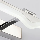 "A close-up view of a modern LED vanity light showing the polished chrome finish and the wave design detail."