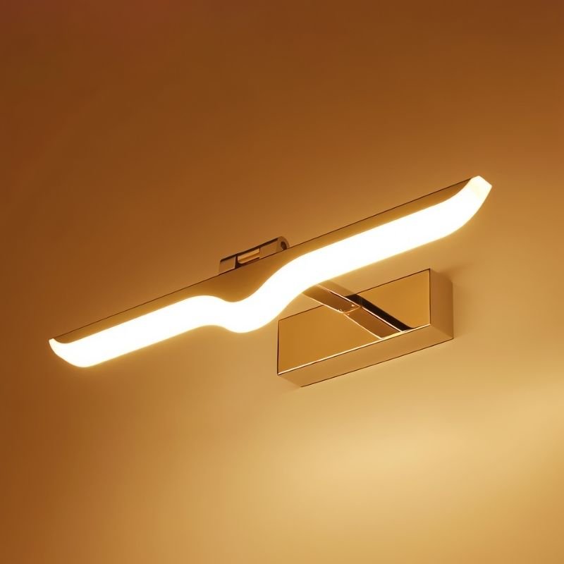 "A modern LED vanity light emitting warm light, mounted on a wall, showcasing its sleek design and balanced illumination for a bathroom setting."