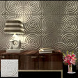 Egena Wall Panel with spiral 3D design in metallic finish, enhancing a modern living room with PVC wall panel decor.
