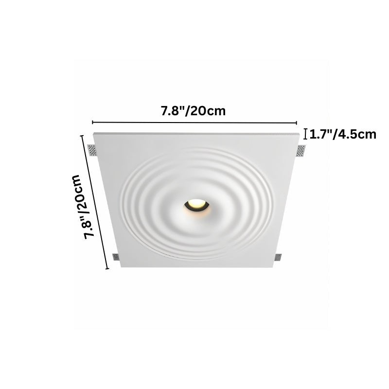 "Three white ceiling lights with concentric circles, installed flush in a white ceiling above a modern artwork."