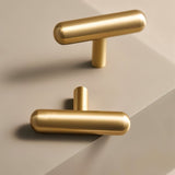 "Modern minimalist brushed brass T-bar pulls for contemporary cabinets and drawers."