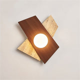 "Eldis Wall Lamp showcasing a modern angular design made of travertine and walnut wood, with a round light source, providing a warm and diffused glow."