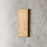 "vertical brass wall lamp, minimalist modern design, ambient wall lighting"