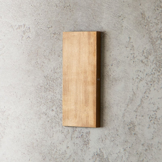 "vertical brass wall lamp, minimalist modern design, ambient wall lighting"