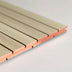 Beige slat wall panel with copper-colored metal trim and interlocking groove joints on white background.