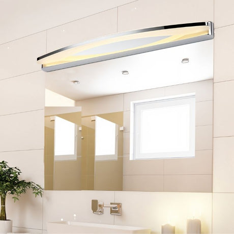 "A stainless steel LED vanity light mounted above a bathroom mirror with a sink and window reflection."