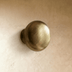 Brushed nickel cabinet pull with curved handles, 4.5 inches wide, front view on white background.