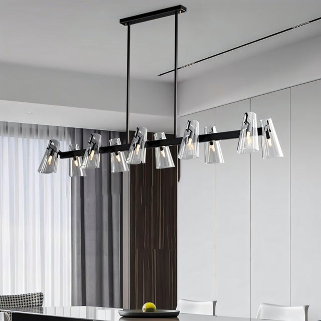 "A linear black brass chandelier with cone-shaped acrylic shades over a dining table."